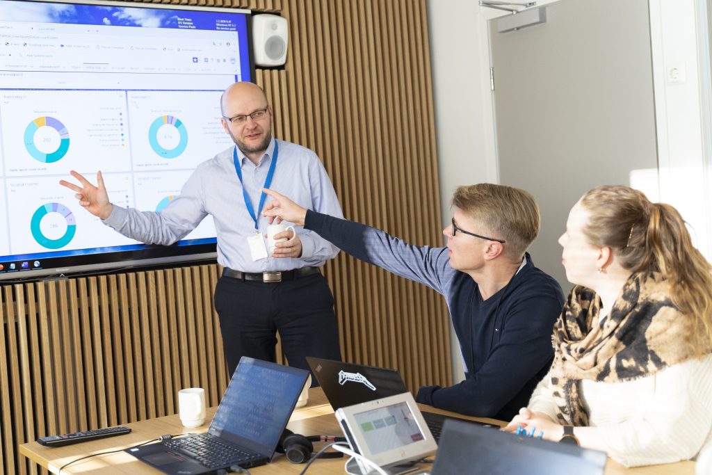 A man presenting something in front of other people